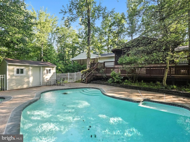 7491 Slagle Ln, Manassas, VA 20111 - view of swimming pool with a deck, an outdoor structure, stairway, a patio, and view of scattered trees