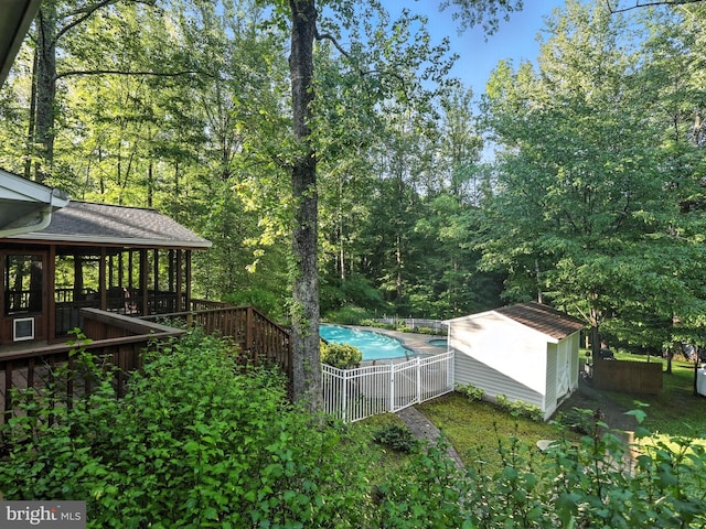 7491 Slagle Ln, Manassas, VA 20111 - view of yard with a storage unit and a wooden deck