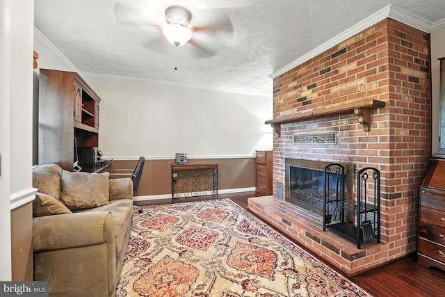 7491 Slagle Ln, Manassas, VA 20111 - living room with a ceiling fan, wood finished floors, a textured ceiling, a fireplace, and ornamental molding