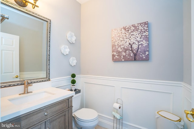 14 Stanley Dr, Monroe Township, NJ 08831 - half bath featuring a decorative wall, a wainscoted wall, and vanity