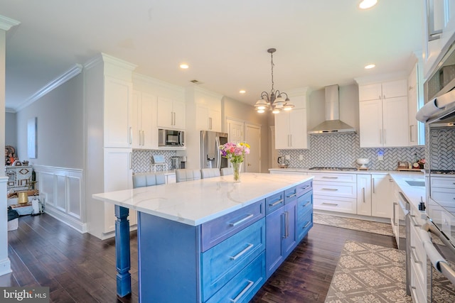 14 Stanley Dr, Monroe Township, NJ 08831 - kitchen with wall chimney range hood, blue cabinetry, white cabinets, dark wood-style flooring, and ornamental molding