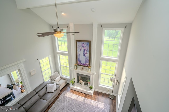 14 Stanley Dr, Monroe Township, NJ 08831 - living room with high vaulted ceiling, wood finished floors, a ceiling fan, and a fireplace with raised hearth