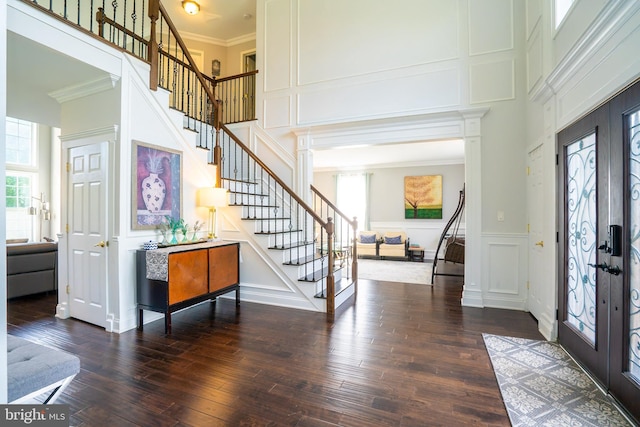14 Stanley Dr, Monroe Township, NJ 08831 - entrance foyer featuring a decorative wall, stairs, crown molding, hardwood / wood-style floors, and a towering ceiling