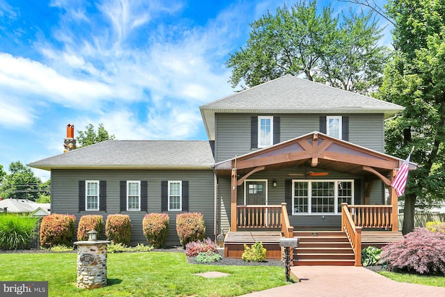 127 Spruce St, Middletown, PA 17057 - view of front of home featuring ceiling fan, a front yard, a porch, roof with shingles, and a chimney