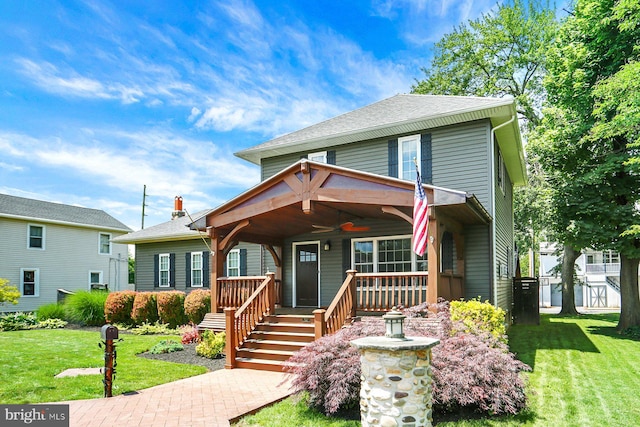 127 Spruce St, Middletown, PA 17057 - american foursquare style home with ceiling fan, covered porch, a front yard, and a shingled roof