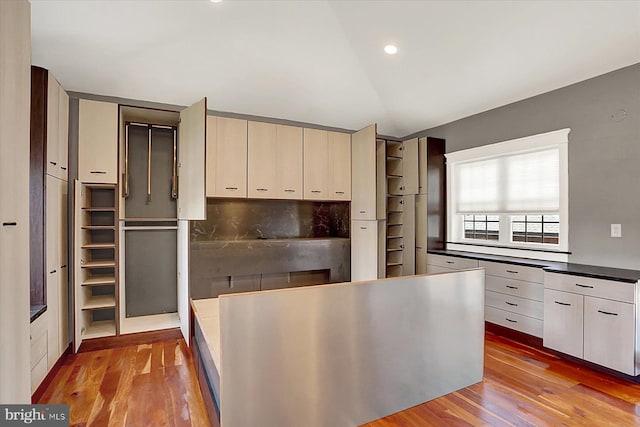 127 Spruce St, Middletown, PA 17057 - kitchen featuring wood finished floors, vaulted ceiling, dark countertops, and recessed lighting