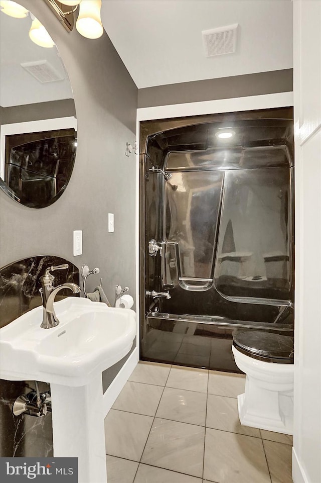 127 Spruce St, Middletown, PA 17057 - full bath featuring toilet and tile patterned flooring