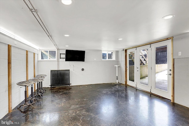 127 Spruce St, Middletown, PA 17057 - below grade area with radiator heating unit, concrete block wall, healthy amount of natural light, and recessed lighting