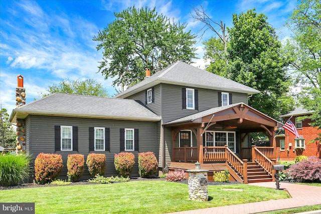 127 Spruce St, Middletown, PA 17057 - american foursquare style home with a chimney, a front yard, and a porch