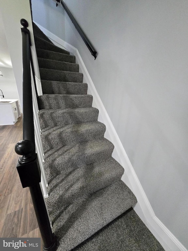 940 E 41st St, Baltimore, MD 21218 - staircase featuring wood finished floors