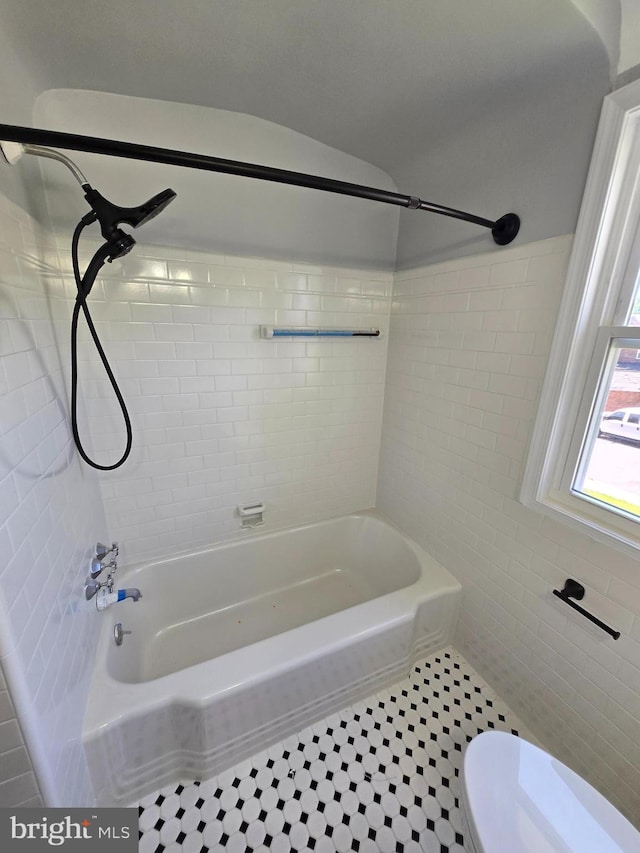 940 E 41st St, Baltimore, MD 21218 - full bathroom with tile walls, shower / tub combination, and tile patterned floors