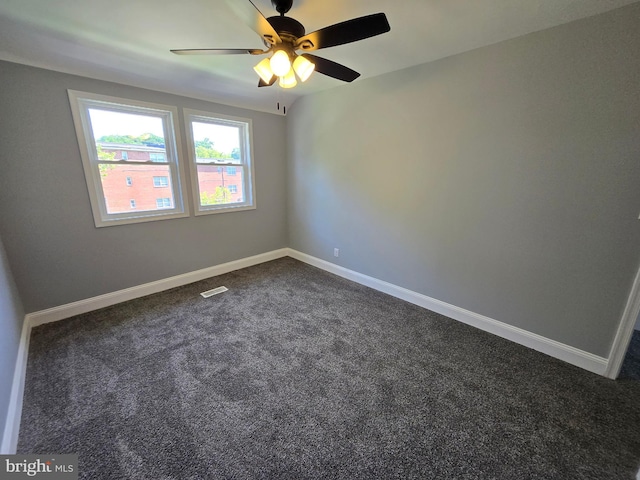 940 E 41st St, Baltimore, MD 21218 - empty room with ceiling fan and dark colored carpet