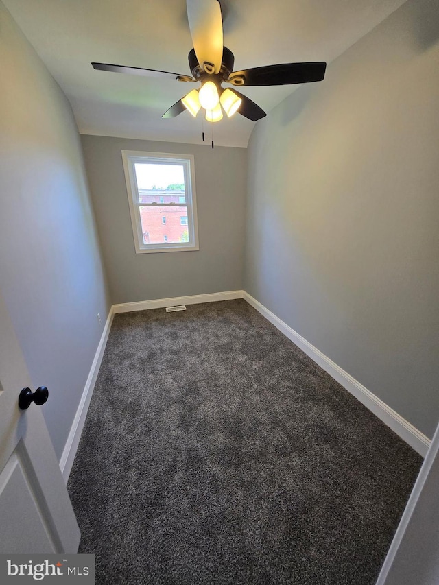 940 E 41st St, Baltimore, MD 21218 - empty room with dark carpet and ceiling fan
