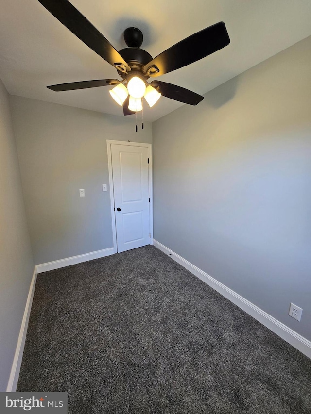 940 E 41st St, Baltimore, MD 21218 - unfurnished room with dark colored carpet and a ceiling fan