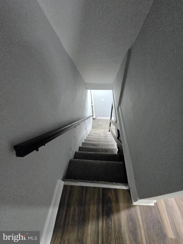 940 E 41st St, Baltimore, MD 21218 - staircase with wood finished floors and a textured ceiling