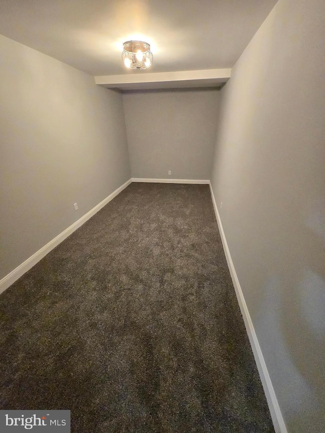 940 E 41st St, Baltimore, MD 21218 - spare room featuring dark carpet and baseboards