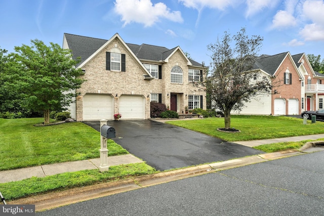 28 White Birch Blvd, Bear, DE 19701 - traditional-style home with driveway, a garage, a front yard, and brick siding