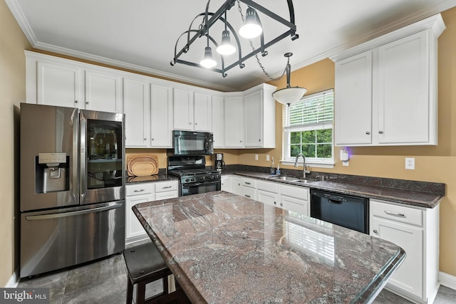 28 White Birch Blvd, Bear, DE 19701 - kitchen featuring black appliances, crown molding, white cabinets, decorative light fixtures, and a kitchen island