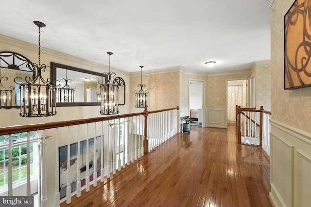 28 White Birch Blvd, Bear, DE 19701 - hallway featuring a chandelier, an upstairs landing, a wainscoted wall, hardwood / wood-style flooring, and crown molding
