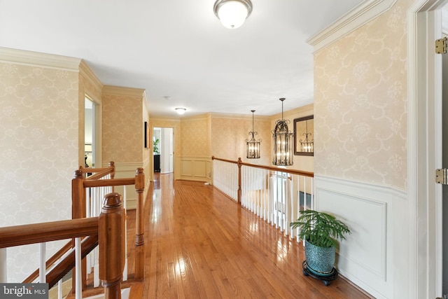 28 White Birch Blvd, Bear, DE 19701 - hall featuring an upstairs landing, wallpapered walls, wainscoting, hardwood / wood-style floors, and a chandelier