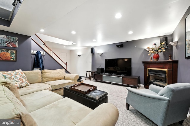 28 White Birch Blvd, Bear, DE 19701 - carpeted living area featuring recessed lighting, stairs, and a glass covered fireplace
