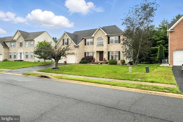 28 White Birch Blvd, Bear, DE 19701 - view of front facade with a garage, asphalt driveway, a front lawn, and brick siding