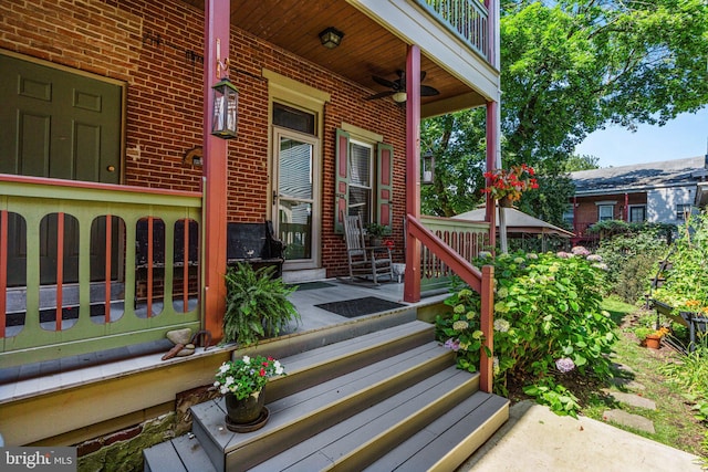 125 N Hanover St, Pottstown, PA 19464 - property entrance featuring brick siding, a porch, and a ceiling fan