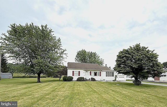 619 Penn Dr, Tamaqua, PA 18252 - view of front of home with a front lawn, a garage, and a storage unit