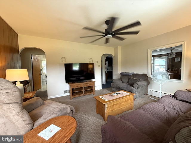 619 Penn Dr, Tamaqua, PA 18252 - living room featuring arched walkways, ceiling fan, a baseboard heating unit, carpet floors, and baseboard heating