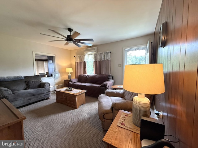 619 Penn Dr, Tamaqua, PA 18252 - living room with a wall unit AC, baseboard heating, a ceiling fan, and carpet flooring