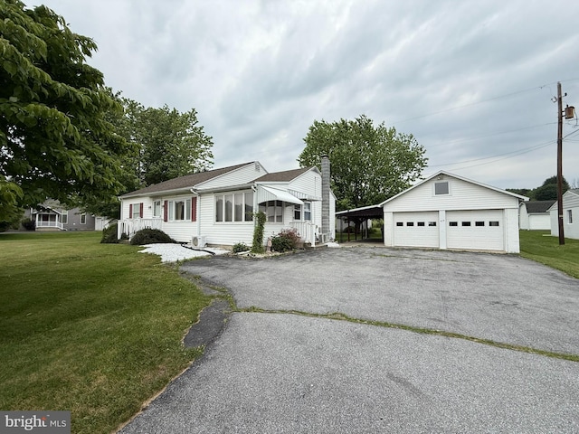 619 Penn Dr, Tamaqua, PA 18252 - single story home with a front yard, a detached garage, a chimney, and an outbuilding
