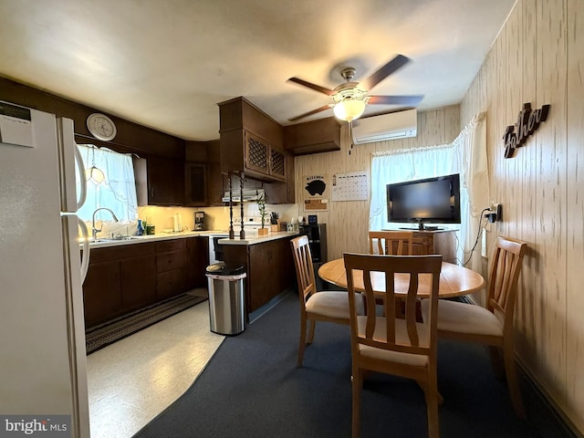 619 Penn Dr, Tamaqua, PA 18252 - dining room with an AC wall unit, a ceiling fan, and wooden walls