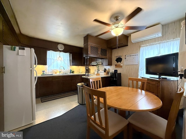619 Penn Dr, Tamaqua, PA 18252 - dining room featuring a wall mounted air conditioner, a ceiling fan, and wooden walls