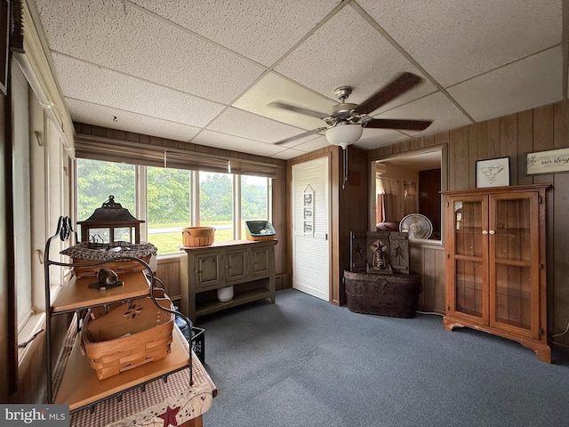 619 Penn Dr, Tamaqua, PA 18252 - sitting room featuring wood walls, a drop ceiling, ceiling fan, and carpet