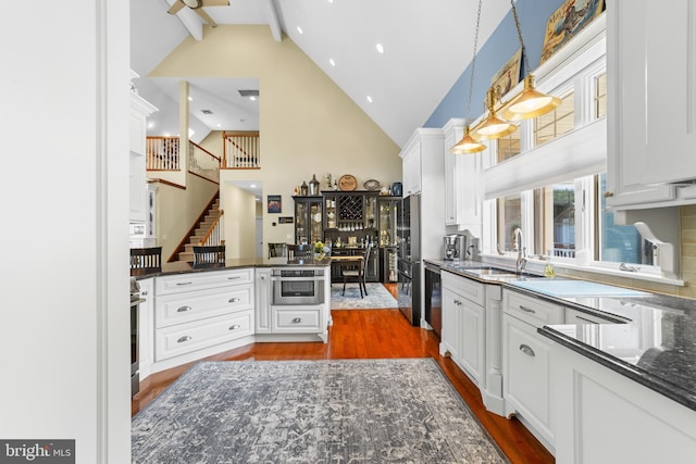 336 Lincoln Rd, Pilesgrove, NJ 08098 - kitchen featuring high vaulted ceiling, white cabinetry, beamed ceiling, dark wood-style flooring, and dark stone counters