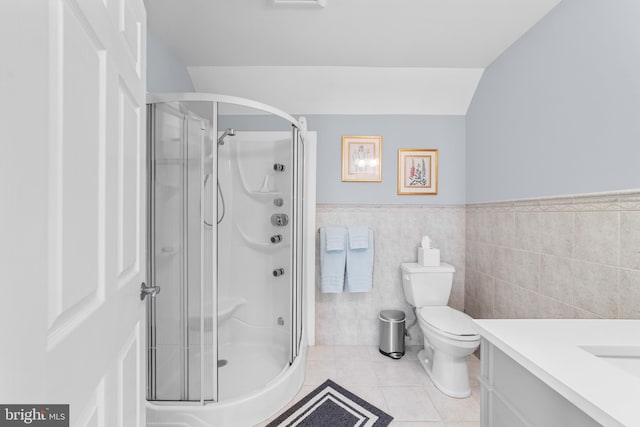 336 Lincoln Rd, Pilesgrove, NJ 08098 - bathroom featuring vanity, a shower stall, tile patterned floors, wainscoting, and tile walls