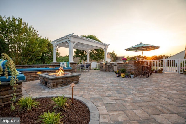 336 Lincoln Rd, Pilesgrove, NJ 08098 - patio terrace at dusk featuring an outdoor fire pit, a patio area, and a pergola