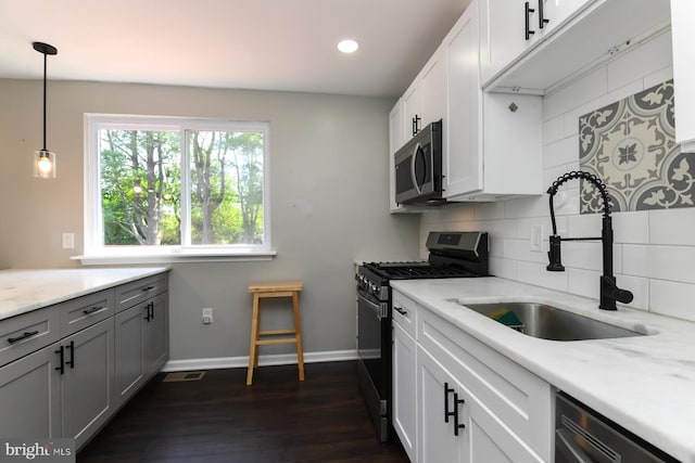754 Second St, Woodbury Heights, NJ 08097 - kitchen with appliances with stainless steel finishes, tasteful backsplash, recessed lighting, dark wood finished floors, and pendant lighting