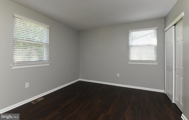 754 Second St, Woodbury Heights, NJ 08097 - unfurnished bedroom with dark wood-type flooring and a closet