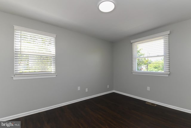 754 Second St, Woodbury Heights, NJ 08097 - spare room with baseboards and dark wood-style flooring