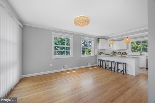 1305 Heather Hill Rd, Baltimore, MD 21239 - living area featuring crown molding and light wood-type flooring