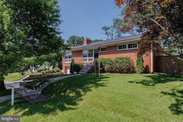 1305 Heather Hill Rd, Baltimore, MD 21239 - view of front of home featuring brick siding, stairs, a chimney, and an attached garage
