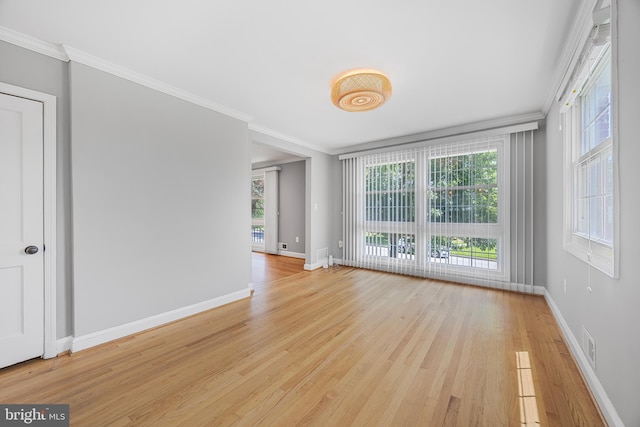 1305 Heather Hill Rd, Baltimore, MD 21239 - spare room featuring light wood finished floors and crown molding