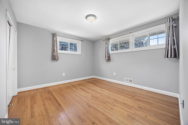 1305 Heather Hill Rd, Baltimore, MD 21239 - unfurnished bedroom featuring light wood-type flooring and a closet