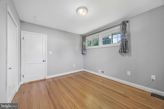1305 Heather Hill Rd, Baltimore, MD 21239 - unfurnished bedroom featuring light wood finished floors and a closet