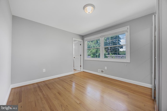 1305 Heather Hill Rd, Baltimore, MD 21239 - unfurnished room featuring baseboards and light wood-style flooring