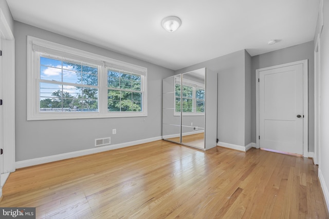 1305 Heather Hill Rd, Baltimore, MD 21239 - unfurnished bedroom with baseboards and light wood-style floors