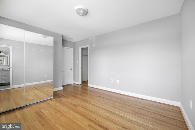 1305 Heather Hill Rd, Baltimore, MD 21239 - unfurnished bedroom featuring wood finished floors