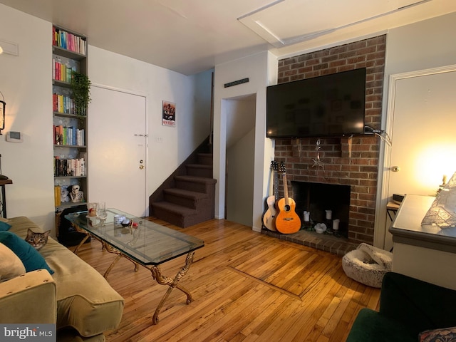 316-322 W Wildey St, Philadelphia, PA 19123 - living room featuring hardwood / wood-style floors, a brick fireplace, and stairway