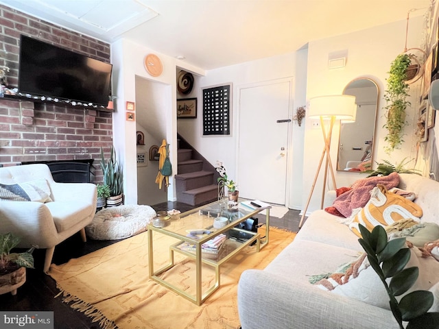 316-322 W Wildey St, Philadelphia, PA 19123 - living room featuring stairway, a fireplace, and wood finished floors